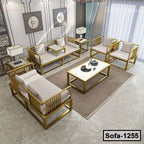 Modern steel sofa set with beige cushions and gold frames in a stylish living room