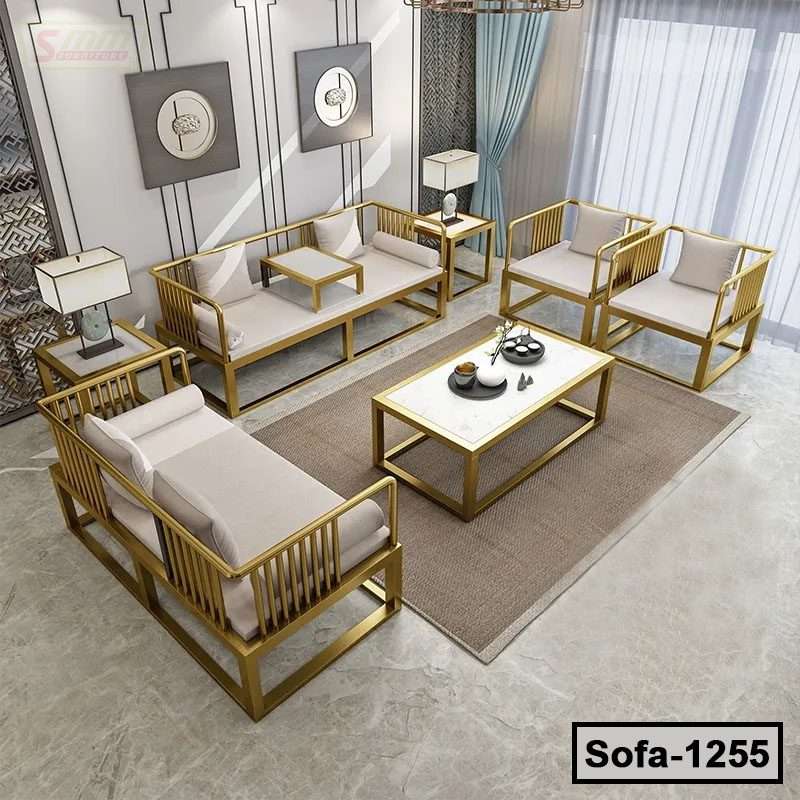 Modern steel sofa set with beige cushions and gold frames in a stylish living room