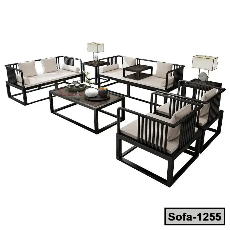Modern steel sofa set with cream cushions, matching coffee table, and side tables with lamps