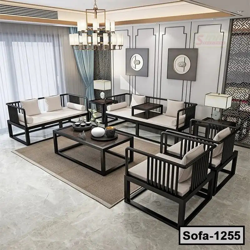 Modern steel frame sofa set with cream cushions in a stylish living room, coffee table centerpiece Main image