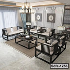 Modern steel frame sofa set with cream cushions in a stylish living room, coffee table centerpiece