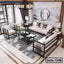 Modern steel frame living room sofa set with light cushions, coffee table, and decorative rug