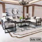 Modern steel frame sofa set with white cushions in a stylish living room with elegant decor
