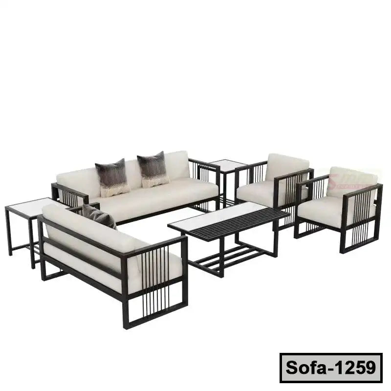 Modern steel frame sofa set with cream cushions, glass tables, and decorative pillows
