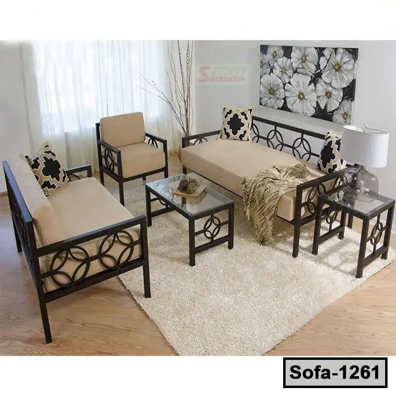 Modern steel frame sofa set with beige cushions and glass tables in a bright living room Main image