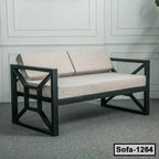 Modern steel frame sofa with light beige cushions, geometric armrests, indoor setting