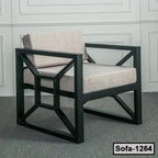 Modern single-seater steel frame sofa with beige cushions in a minimal living room