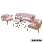 Modern pink cushioned steel sofa set with gold frames and round white coffee tables