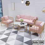 Modern living room with pink velvet steel frame sofa set and marble coffee tables