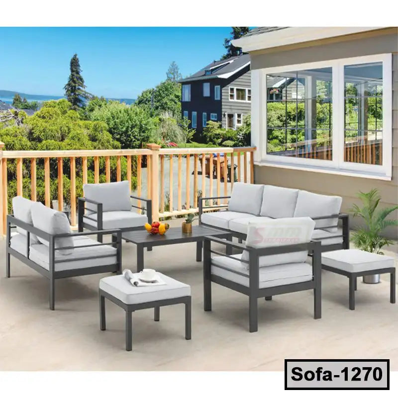 Modern outdoor patio set with steel frame sofas, cushioned seats, and coffee table on terrace