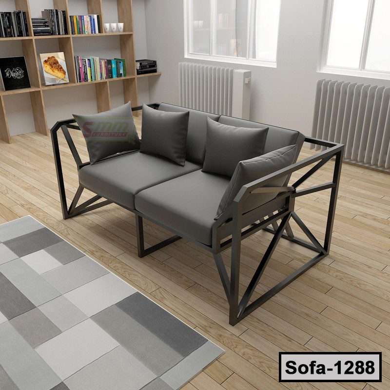Modern steel frame sofa with gray cushions and pillows in a bright living room