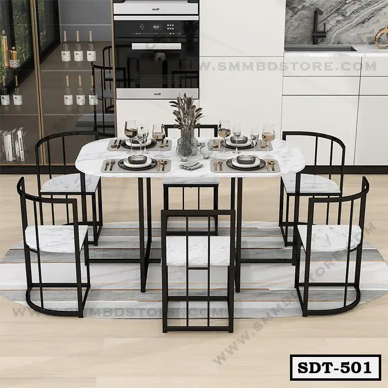 Modern marble top steel dining table set with six chairs in a contemporary kitchen
