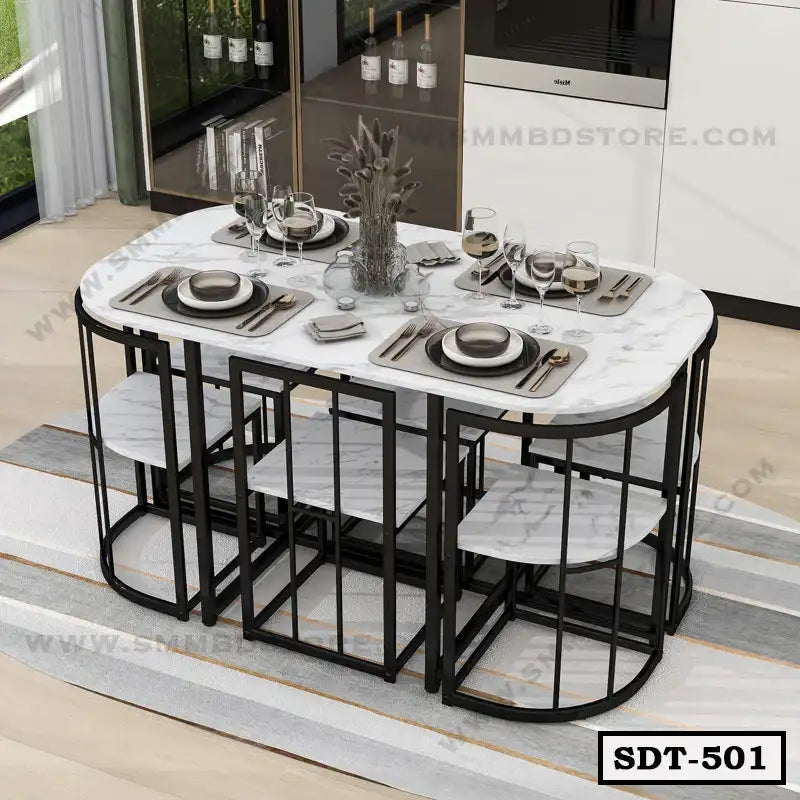 Modern steel dining table with marble top and matching benches, set for six in a stylish dining area.