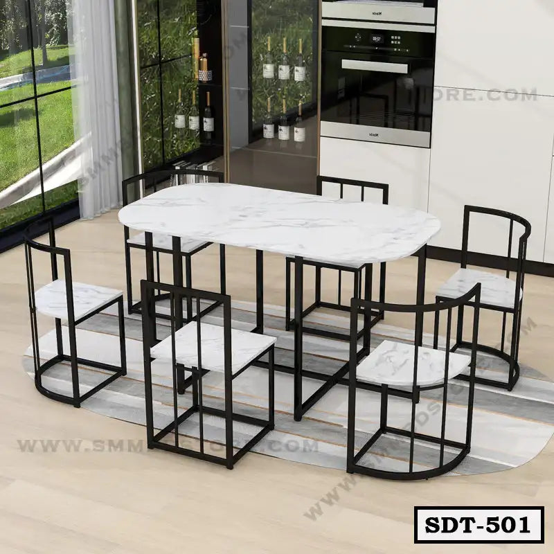 Modern steel dining table set with white marble top and six matching chairs in a bright dining room Main image