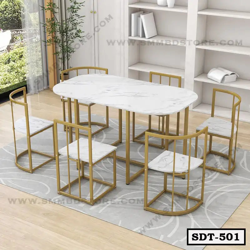 Modern marble top steel dining table set with six chairs on a grey rug in a bright room