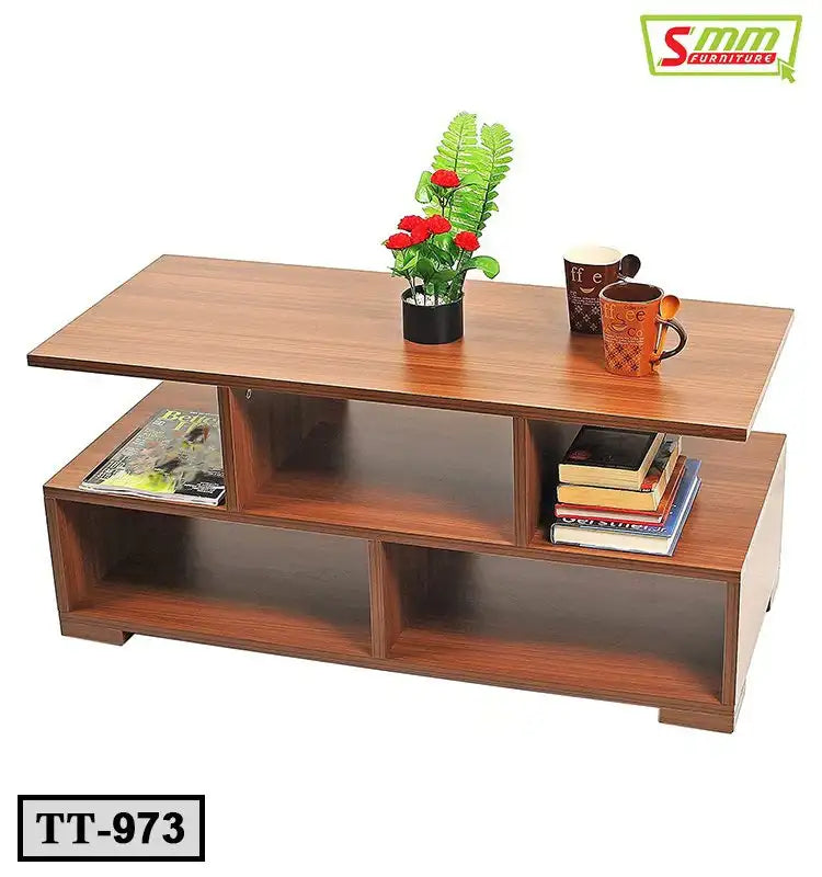 Modern wooden tea table with shelves, books, magazines, mugs, and a small plant