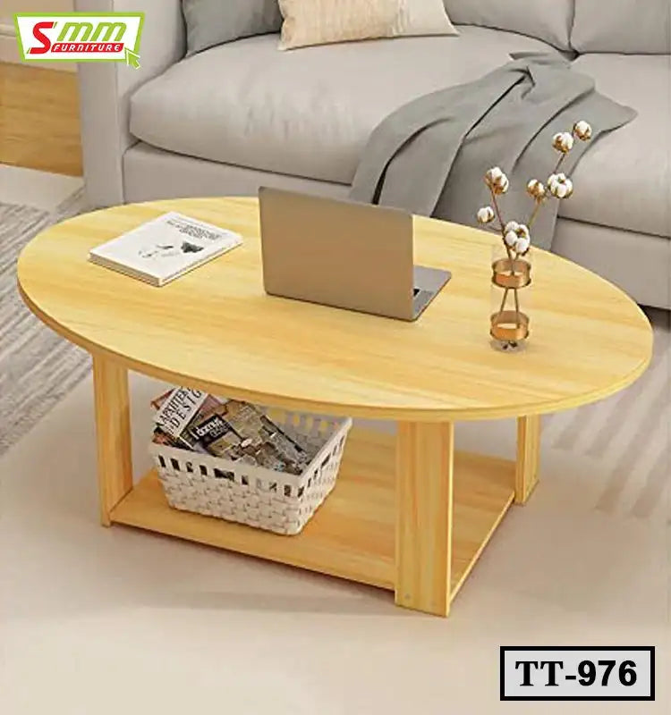 Modern oval wooden tea table with storage shelf, laptop, and vase in a living room setting. Main image