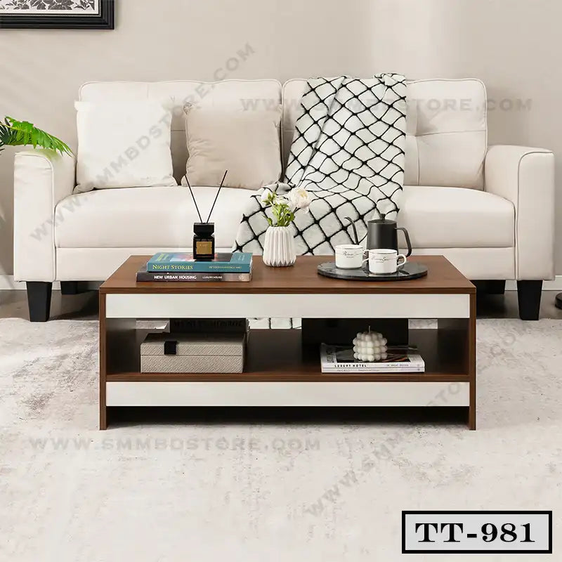 Modern wooden tea table with shelf in living room, styled with books, mugs, and decor.