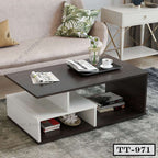 Modern rectangular coffee table with open shelves, dark wood top, books and decor in a living room