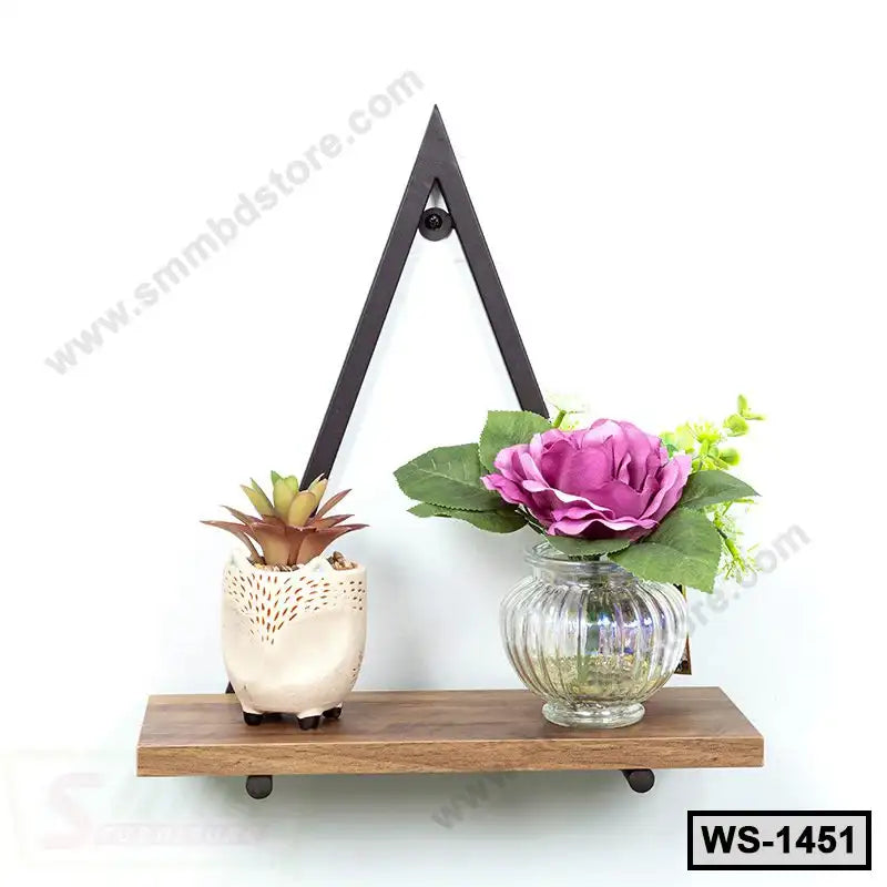 Wooden wall shelf with black metal frame, holding a small potted plant and a purple faux flower