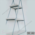 Modern triangular wall shelf with three white wooden tiers and metal frame, home decor furniture.