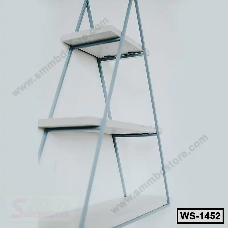Modern triangular wall shelf with three white wooden tiers and metal frame, home decor furniture.