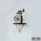 Modern wall shelf with black vase and flowers, minimalist decor, wooden bracket design.
