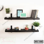 Modern black wall shelves with decor, books, plants and picture frames on white wall