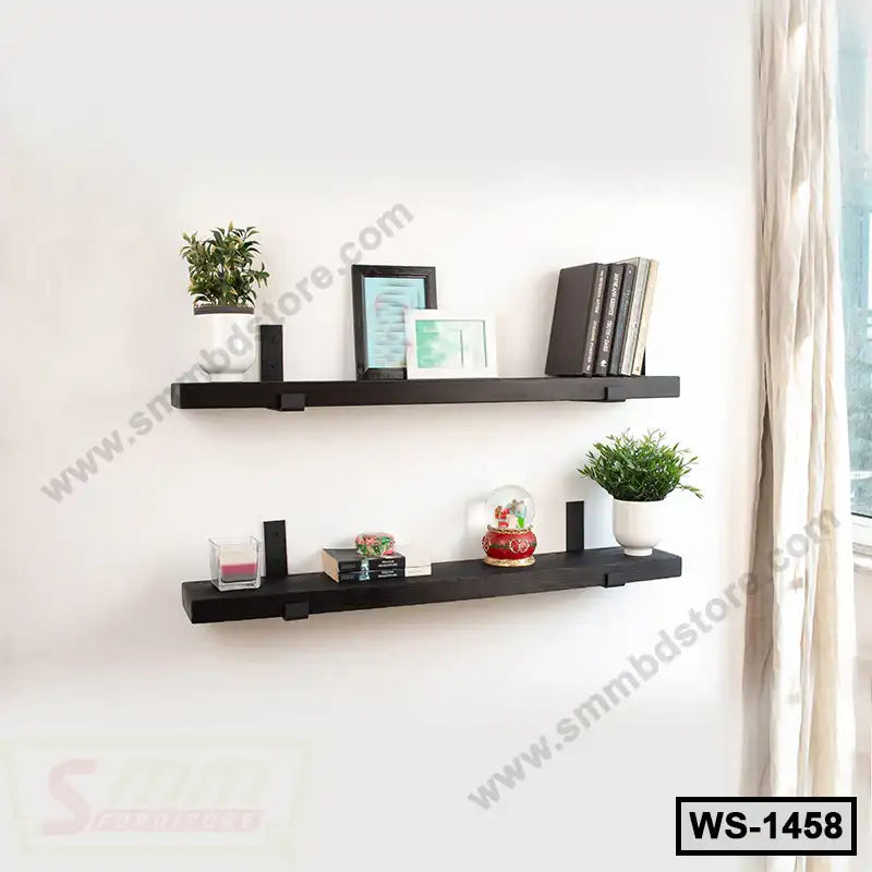 Modern black wall shelves with books, plants, and decor in a bright living room