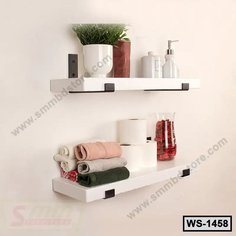 Modern white wall shelves with towels, plants, toilet paper, and bathroom accessories