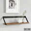 Modern wall shelf with black metal frame and wooden base, holding white ceramic vases