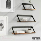 Set of three modern wall shelves with black metal frames and wooden boards on a gray wall.