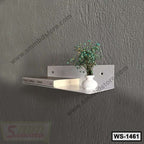 Modern white wall shelf with book and small vase decor, mounted on gray textured wall