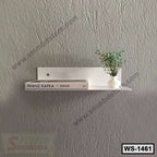 Modern white wall shelf with a book and small decorative vase on a textured gray wall