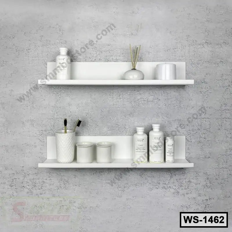 Modern white wall shelves with decorative items mounted on a textured gray wall