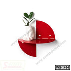 Modern red wall shelf with a white vase and green plant for home or office decor