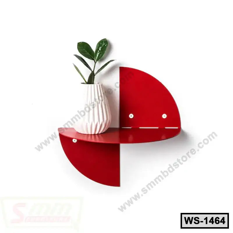 Modern red wall shelf with a white vase and green plant for home or office decor