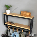 Modern wall shelf with black metal frame, wood shelves, hooks, and decorative items