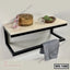 Modern wall-mounted shelf with black metal frame, wood top, and towel bar, styled for home or office use.
