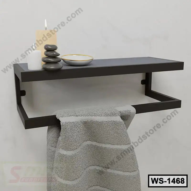Modern wall-mounted shelf with towel rack, candles, stones and bowl for home or bathroom
