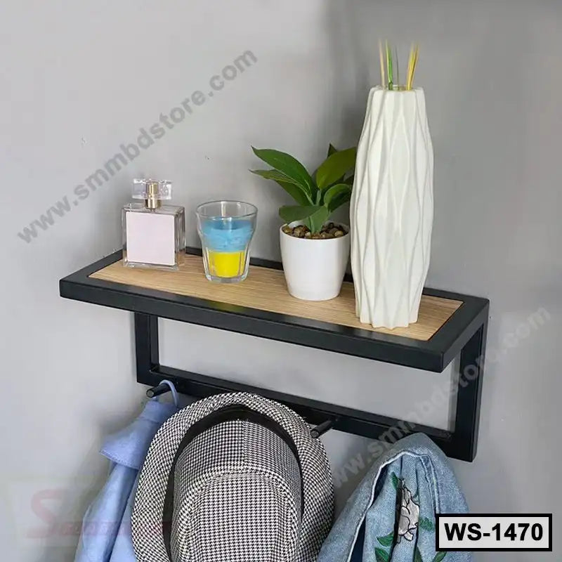 Modern wall shelf with black frame, holding decor, plant and vase, with hooks for hanging items Main image