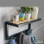 Modern wall shelf with metal frame, wooden base, hooks, and home decor items