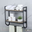 Modern wall-mounted bathroom shelf with towels, toilet paper, and small potted plant