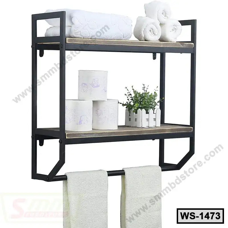 Wall-mounted shelf with metal frame, two tiers holding towels, toilet paper, and small plant.