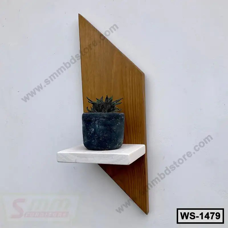 Modern wall shelf with geometric wooden back and a small potted plant on a white platform