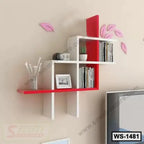 Modern red and white wall shelf with books, plant, vase, and photo frame on beige wall.