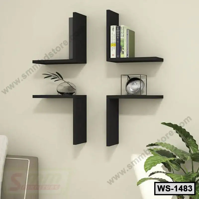 Modern black wall shelves with books and decor, mounted on a beige living room wall.