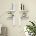 Modern white wall shelves arranged in a corner, displaying books and decor in a living room.