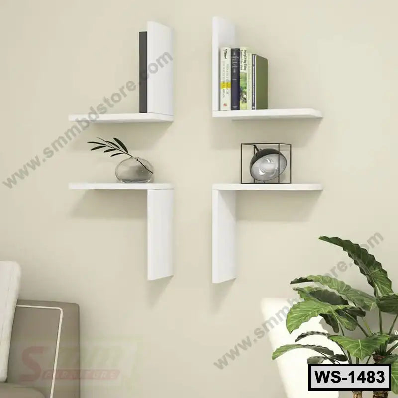 Modern white wall shelves arranged in a corner, displaying books and decor in a living room.