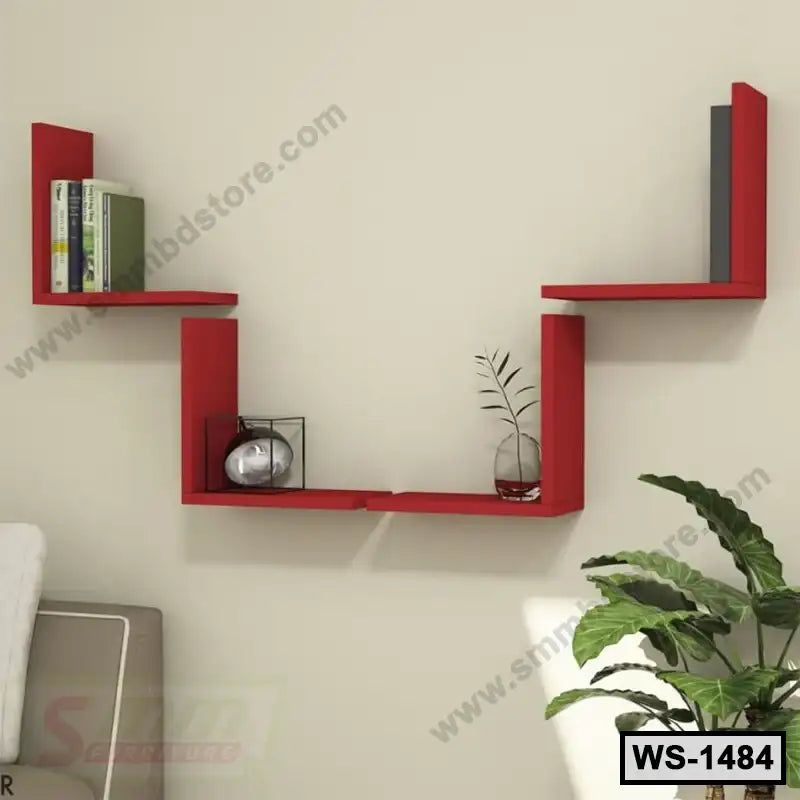 Modern red wooden wall shelf with books and decor in a living room interior